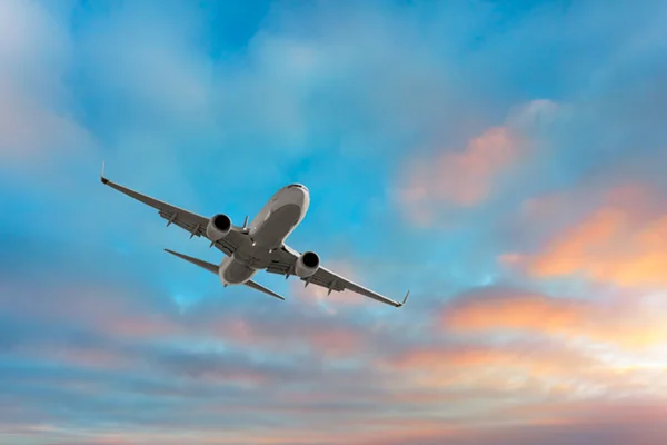 Airplane Flying in Beautiful Blue Sky